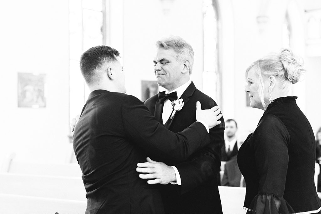 Emotional goodbye between groom and parents