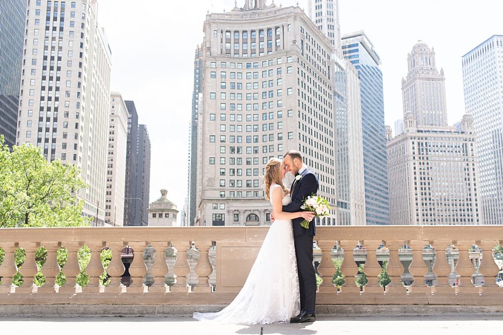Couples poses for portraits along the Chicago River