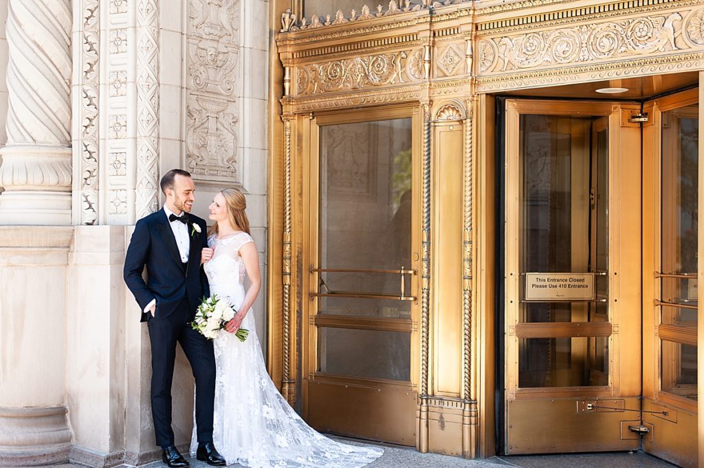 Chicago Couple poses lovingly against classic architecture