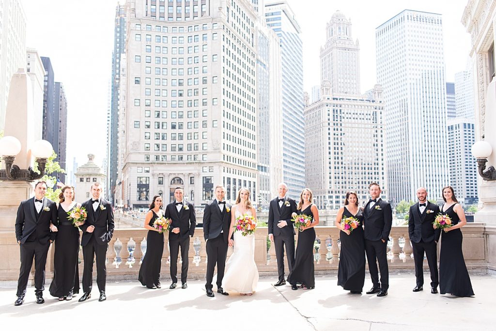 Wedding party poses along the Chicago River walk