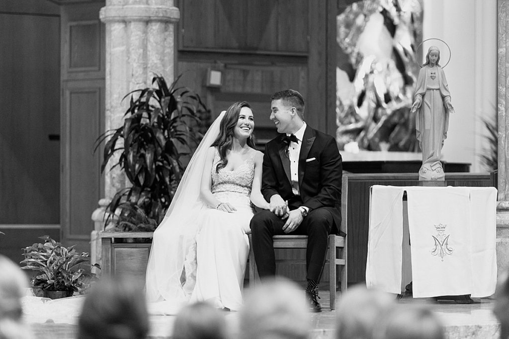 black and white laughing at ceremony