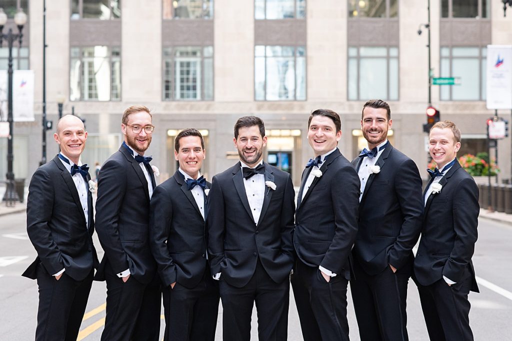 A smiling group of groomsmen