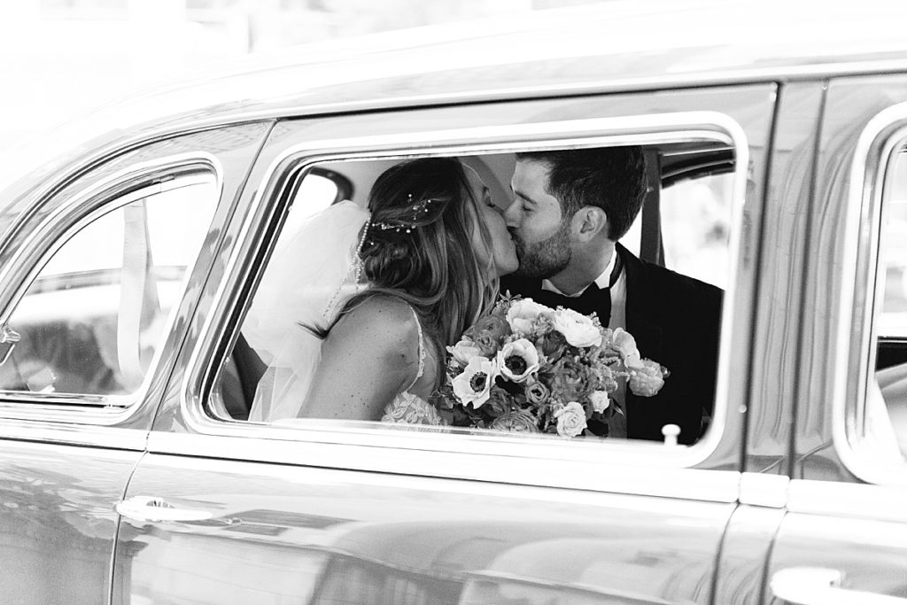 A classic car and a classic kiss