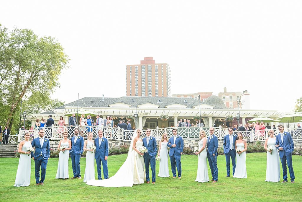 Bridal party is posed along the outside of the venue