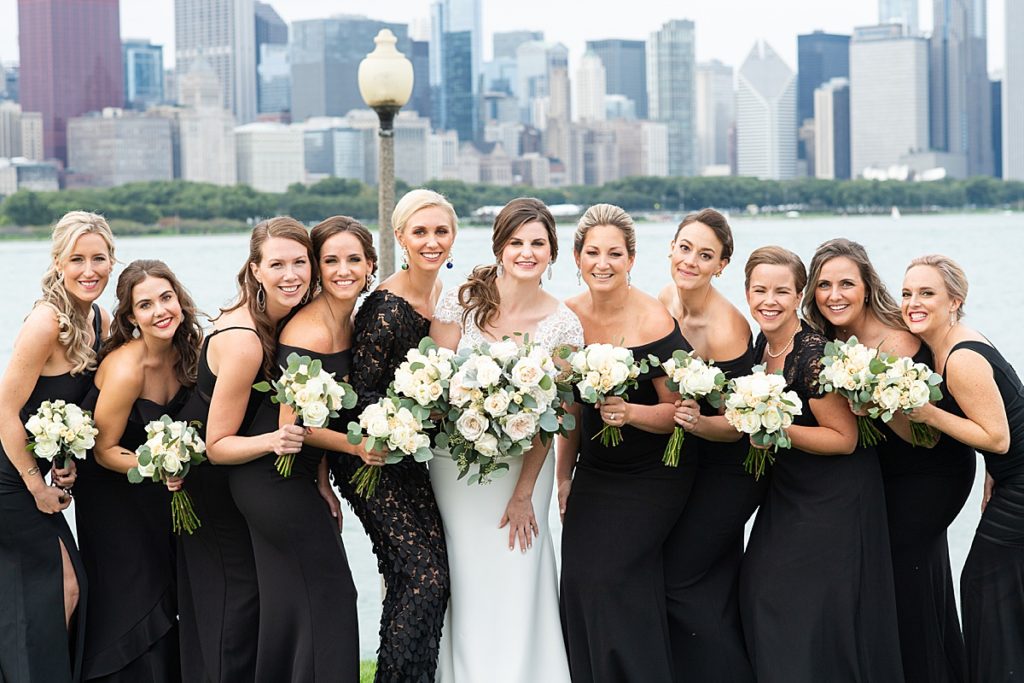 Bride and bridesmaids gather outside