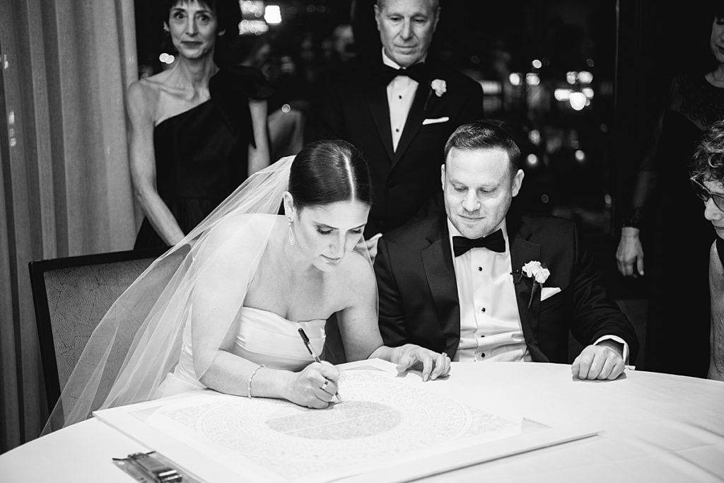 Special moment captured of the ketubah signing
