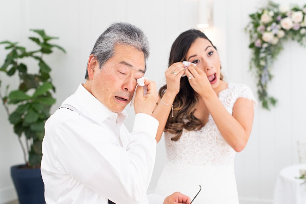 bride and father of the bride crying