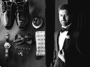 The groom prepares for a black tie affair to remember