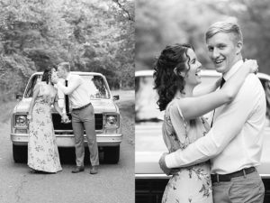 Man and woman kissing in front of vintage Chevy truck for their anniversary session. In the second photo, the woman has her arms around the man and the man has his arms around her waist. The woman is smiling up at the man and he is smiling towards the camera. (black and white photo)