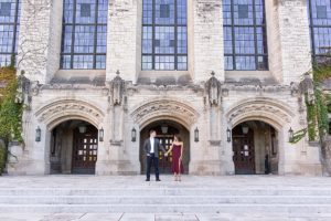 man and woman holding hands in front of grand building on Northwestern University's campus