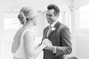 photo of bride and groom smiling at each other