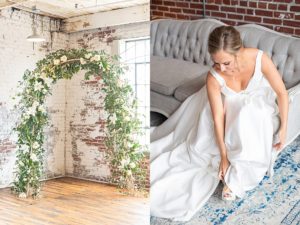 bride putting on shoes while wearing wedding dress and floral arch in industrial wedding venue in downtown Memphis