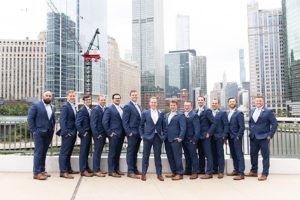 Groom and groomsmen pose for photos in downtown Chicago