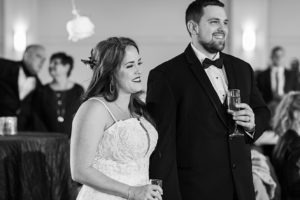 The couple listened to the toasts from their friends and family at their wedding reception