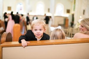 kids play in the pews before the wedding ceremony