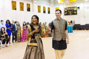 bride and groom pose at traditional Indian wedding festivities