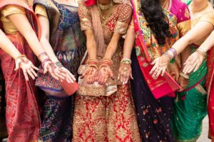 bride and bridesmaids show henna