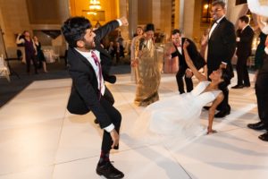 The bride and groom danced on the dance floor at the wedding reception