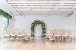 large floral arch at wedding