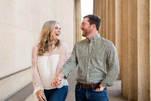 the couple smiled at each other during engagement photos