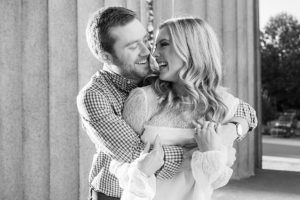 the couple smiled at each other during engagement photos