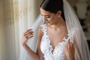 bride wore a gorgeous lace wedding dress and long veil
