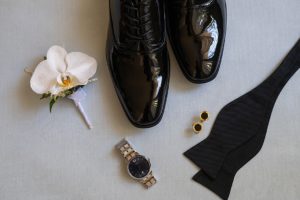 the groom wore classic tux shoes and a black bow tie