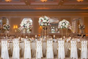 indoor wedding reception with glamorous florals
