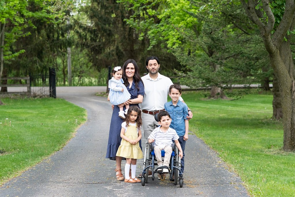 Child in wheelchair, photos with a family of six, at home photos