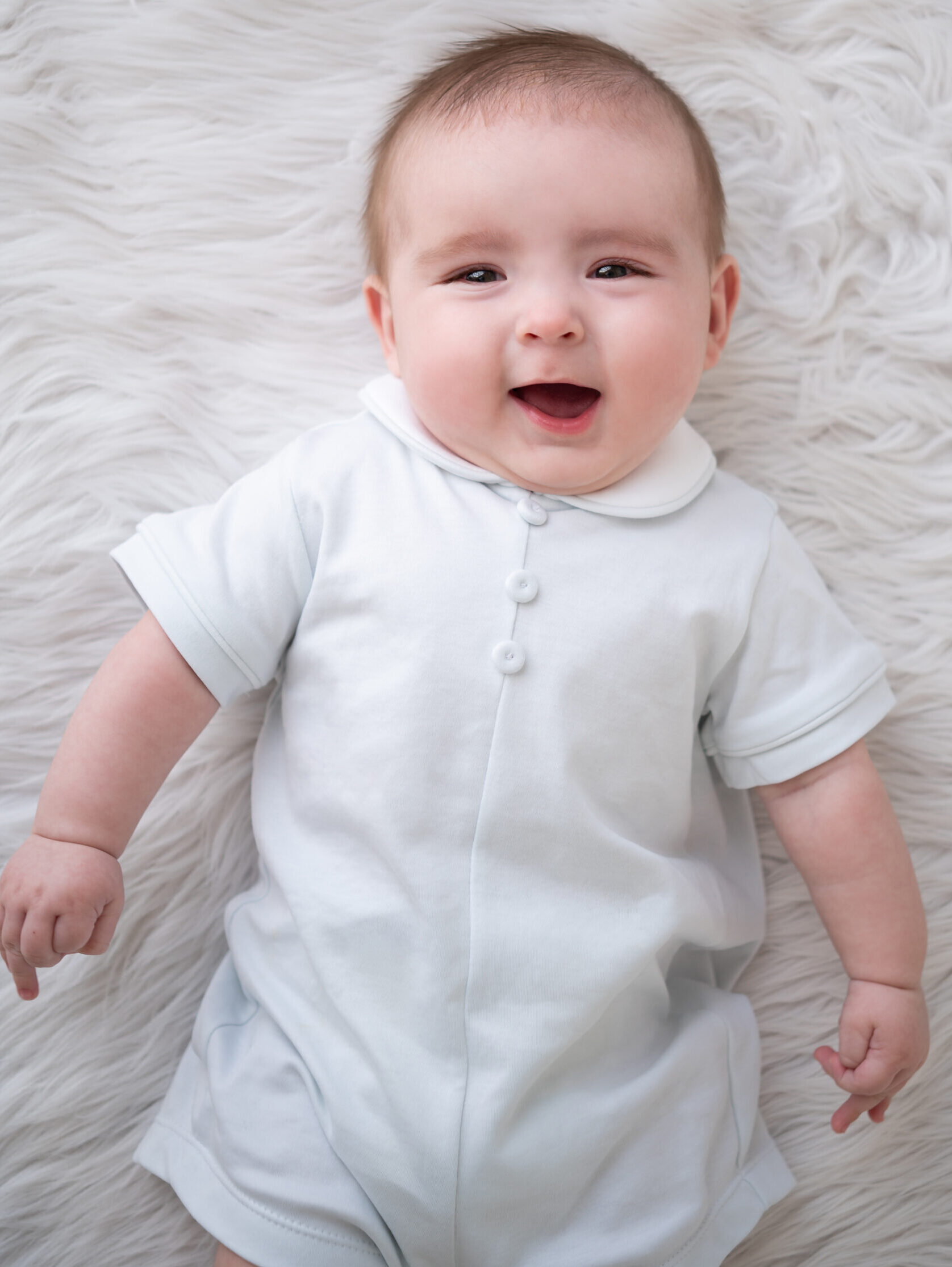 baby in classic outfit for milestone photos